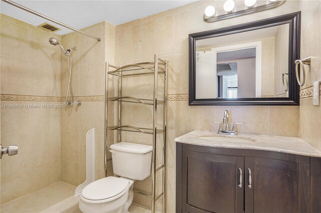 6921 Environ Blvd Unit 8N, Lauderhill, FL 33319 - full bath with tile walls, toilet, vanity, and a tile shower