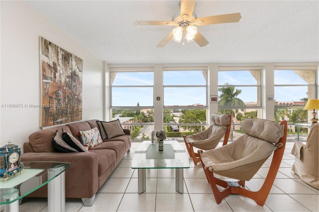 sunroom with a wealth of natural light and ceiling fan