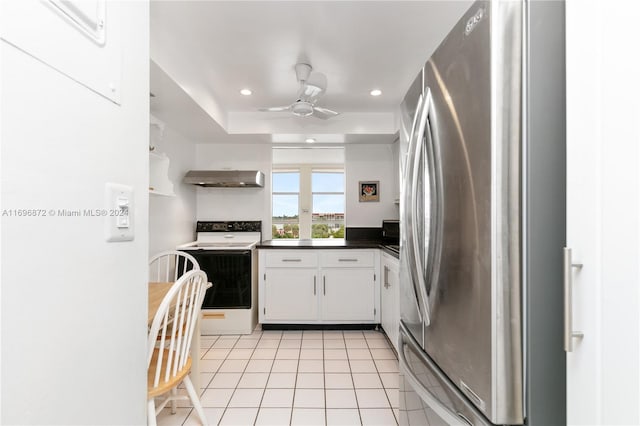 kitchen featuring stainless steel refrigerator, white cabinetry, electric range, ceiling fan, and light tile patterned flooring