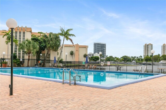 view of swimming pool with a patio area