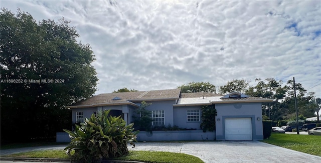 ranch-style home with a garage