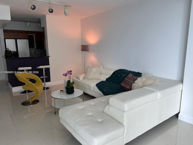 tiled living room with rail lighting