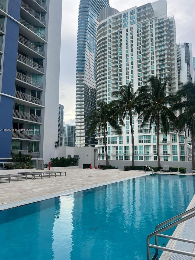 view of swimming pool with a patio area