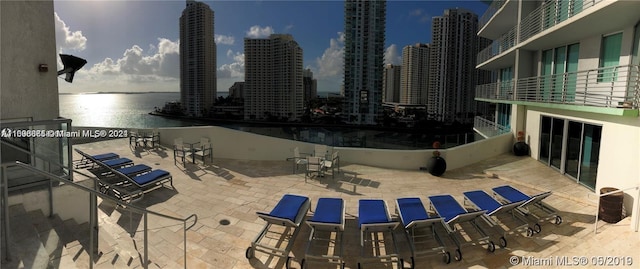 view of patio featuring a water view