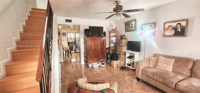 living room featuring ceiling fan and ornamental molding