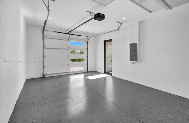 garage featuring a garage door opener and electric panel