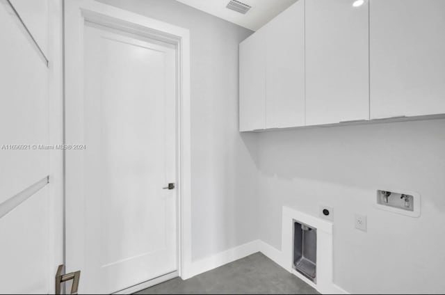 washroom with cabinets, hookup for a washing machine, and electric dryer hookup