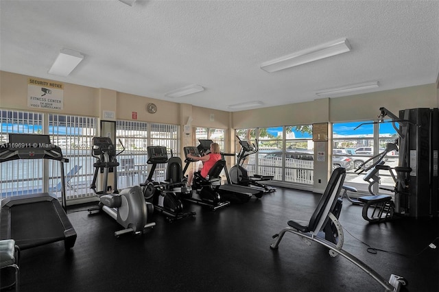 gym with a textured ceiling