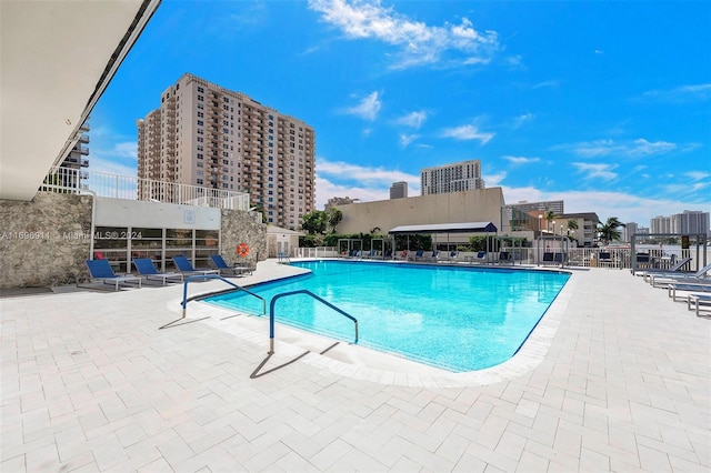 view of swimming pool featuring a patio area