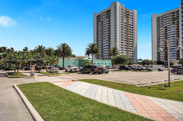 view of property's community with a lawn