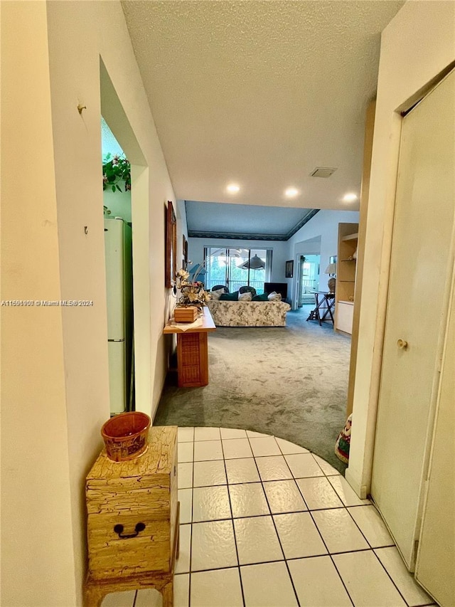 carpeted bedroom featuring a textured ceiling