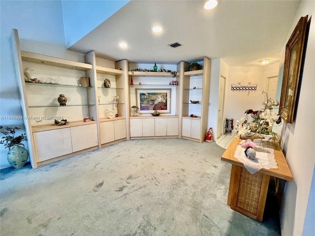 interior space with light colored carpet and a textured ceiling