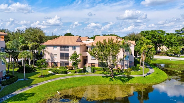 birds eye view of property featuring a water view