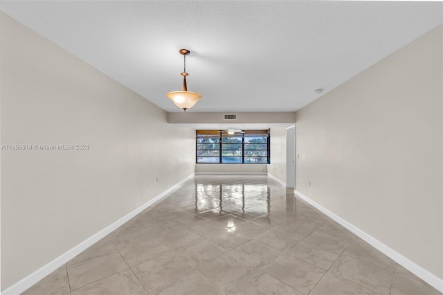 spare room with ceiling fan