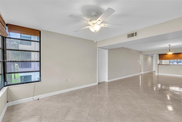 unfurnished room featuring ceiling fan