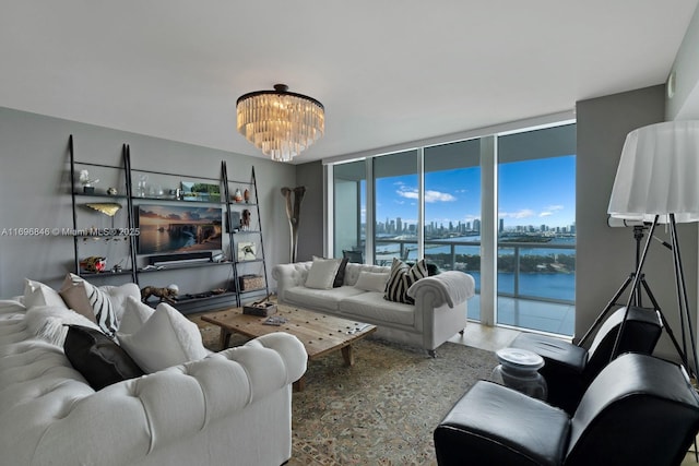 living room with expansive windows and an inviting chandelier