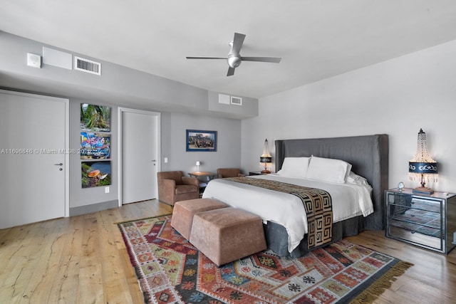 bedroom featuring light hardwood / wood-style floors and ceiling fan