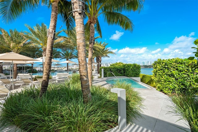 view of pool featuring a water view