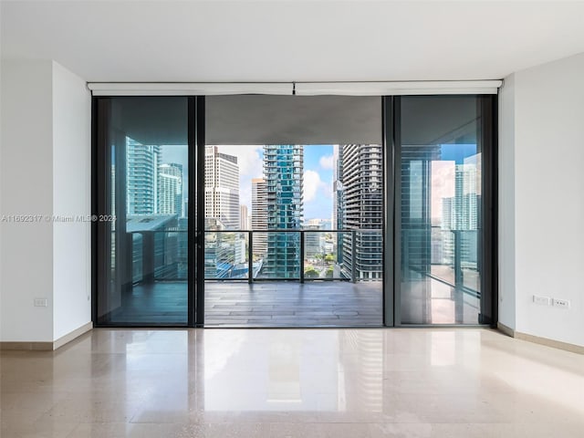 empty room featuring expansive windows