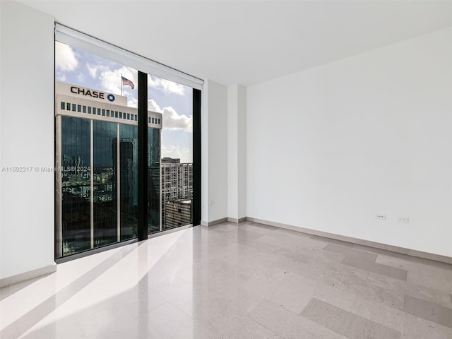 spare room featuring floor to ceiling windows