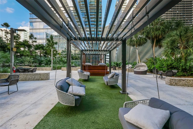 view of patio with an outdoor living space and a pergola