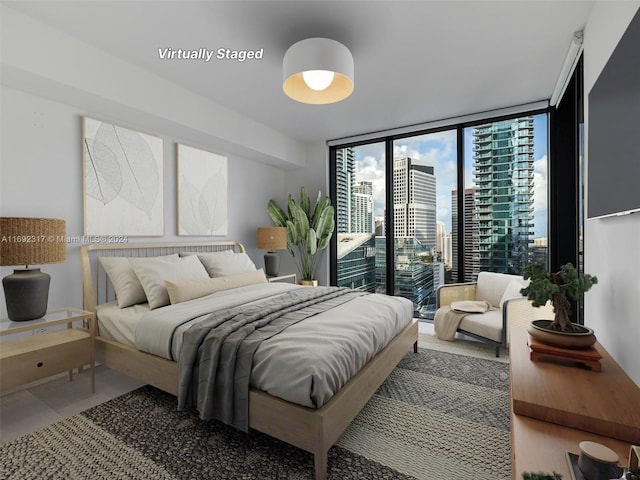 bedroom featuring access to exterior and floor to ceiling windows