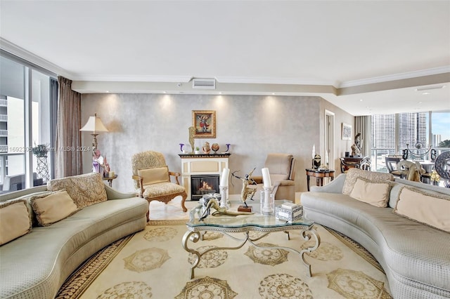 living room featuring ornamental molding and a wall of windows