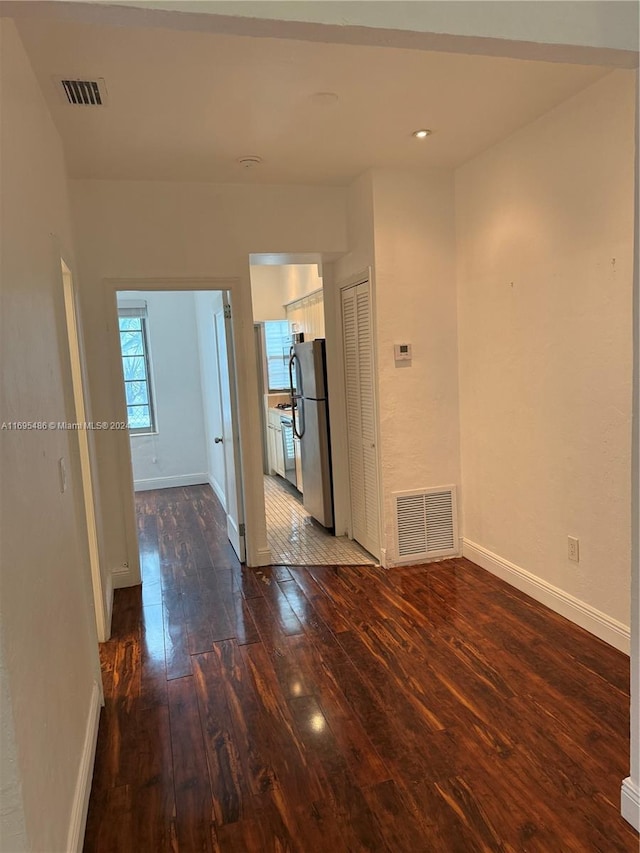 empty room featuring dark hardwood / wood-style floors