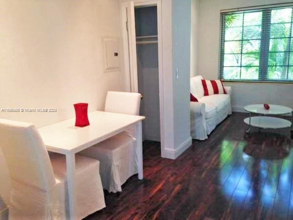 dining room with dark hardwood / wood-style floors