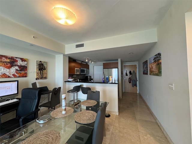 dining room featuring light tile patterned flooring