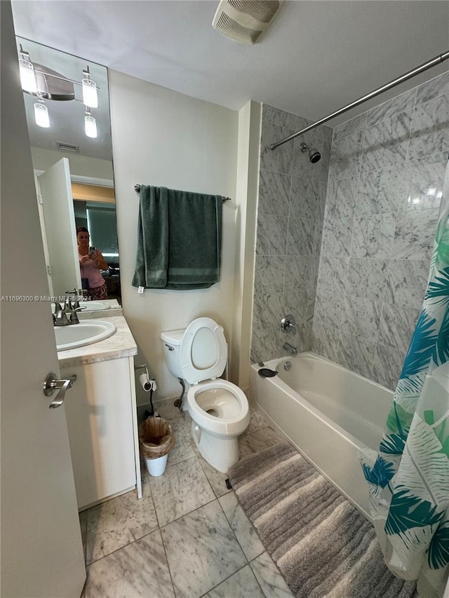 full bathroom with toilet, vanity, and shower / tub combo with curtain