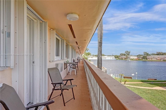 balcony featuring a water view