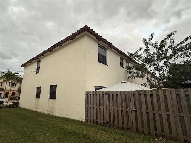 view of home's exterior featuring a yard