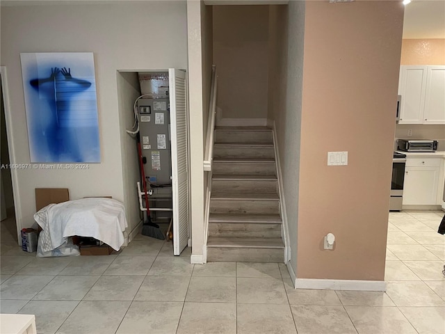 stairs with tile patterned flooring