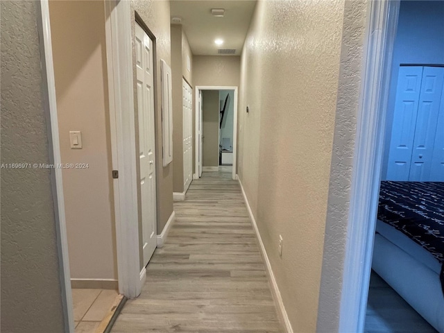 hall featuring light hardwood / wood-style flooring