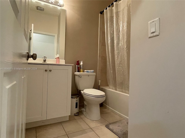 full bathroom with tile patterned flooring, shower / tub combo, vanity, and toilet