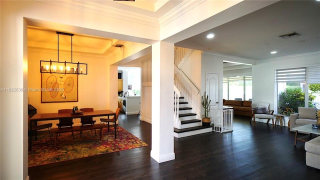 interior space featuring visible vents, wood finished floors, stairs, crown molding, and recessed lighting