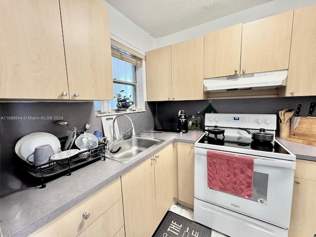 kitchen with light brown cabinetry, a textured ceiling, white range oven, and sink