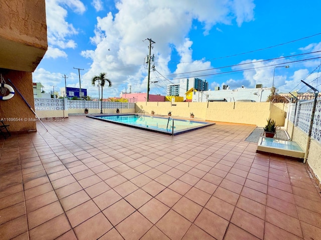 view of patio / terrace featuring a community pool