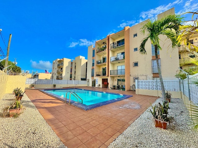 view of swimming pool with a patio