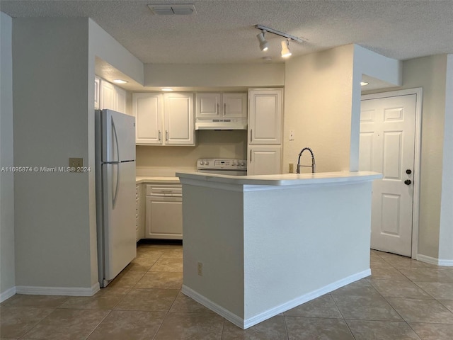 kitchen with white cabinets, white appliances, a textured ceiling, and light tile patterned floors