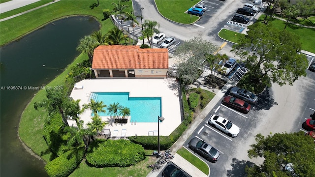 birds eye view of property featuring a water view