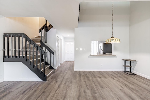 unfurnished living room with wood-type flooring