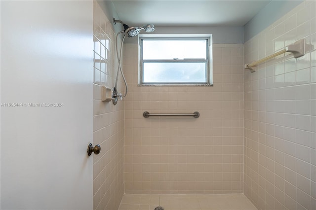 bathroom with a tile shower