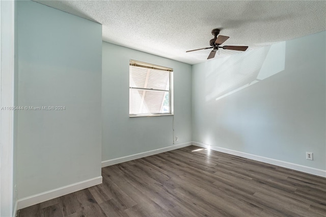 spare room featuring a textured ceiling, dark hardwood / wood-style flooring, and ceiling fan