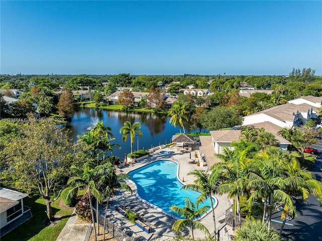 birds eye view of property with a water view