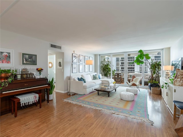 living room with light hardwood / wood-style flooring