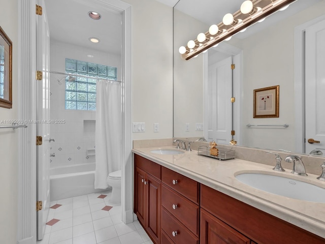 full bathroom featuring tile patterned floors, vanity, toilet, and shower / bath combo with shower curtain