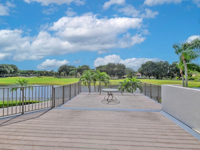 wooden deck with a water view