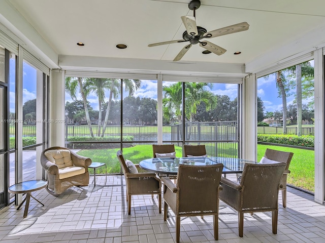 sunroom / solarium with ceiling fan